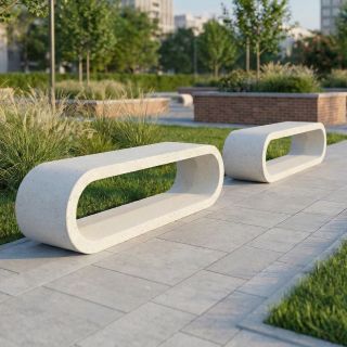 نیمکت بتنی مدرن با طراحی بیضی‌شکل توخالی در مسیر پیاده‌روی فضای سبز و پارک، موجود در فروشگاه اینترنتی سازنده باش. (Modern concrete bench with a hollow oval design on a walking path in a green space and park, available in the Sazandebash online store.)